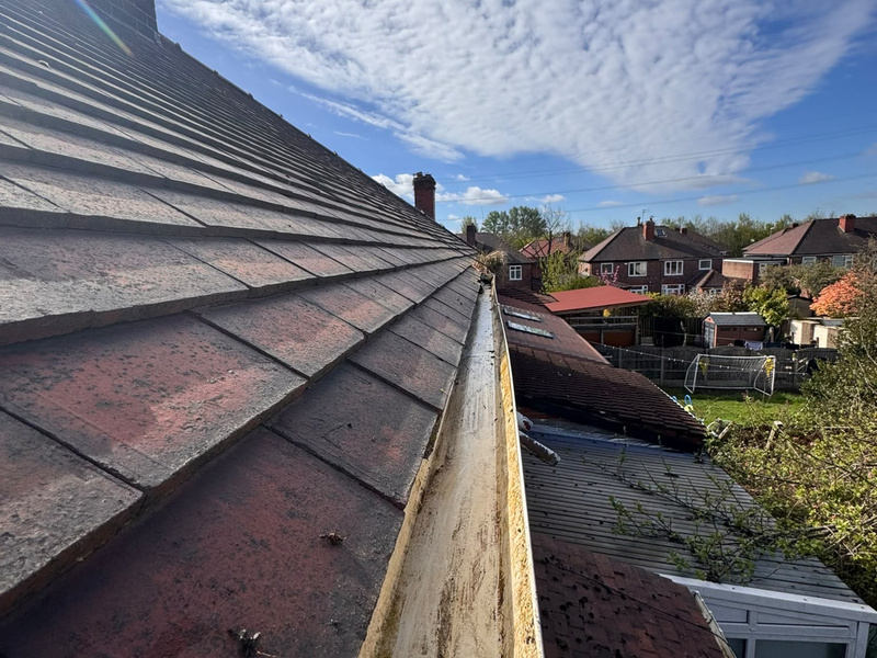Clean residential gutter after maintenance